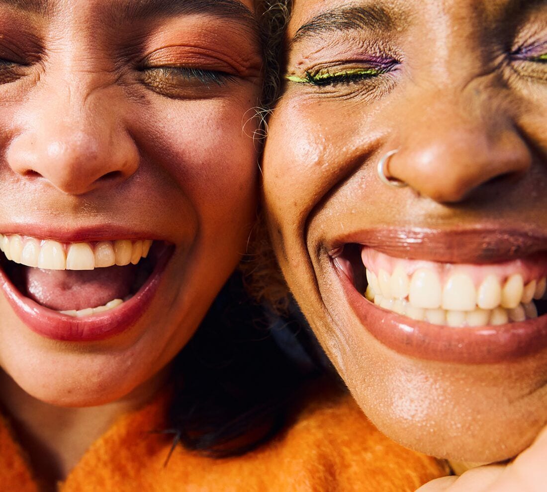 two friends laughing together